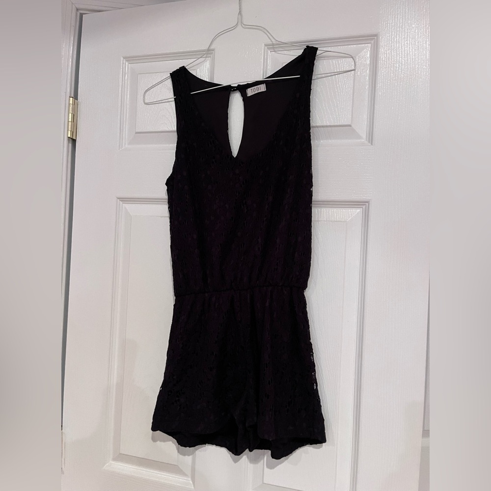 Cute black eyelet romper!  Can dress up or wear casual!
